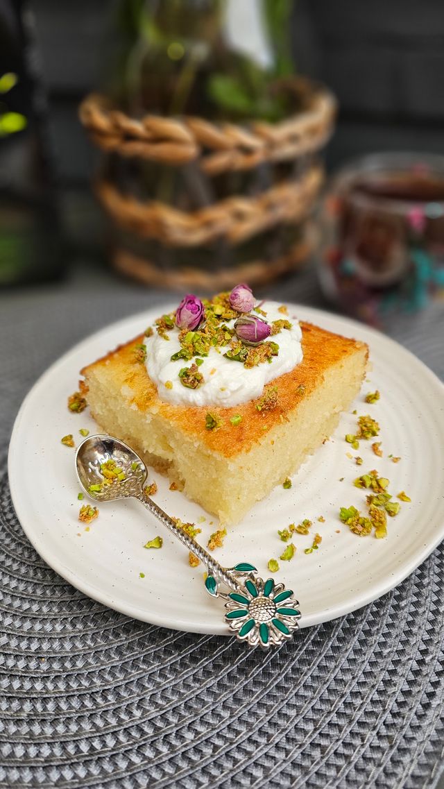 Semolina pudding topped with cream and pistachios, an easy no bake Eid dessert