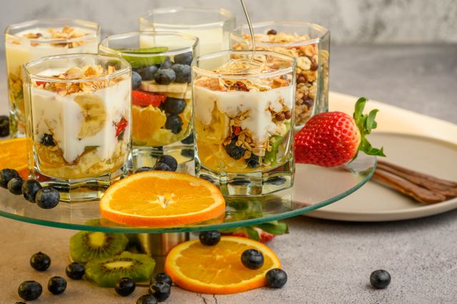 Layered yogurt fruit parfaits with fresh strawberries and oranges, a simple and light Eid dessert recipe without eggs and gelatin.