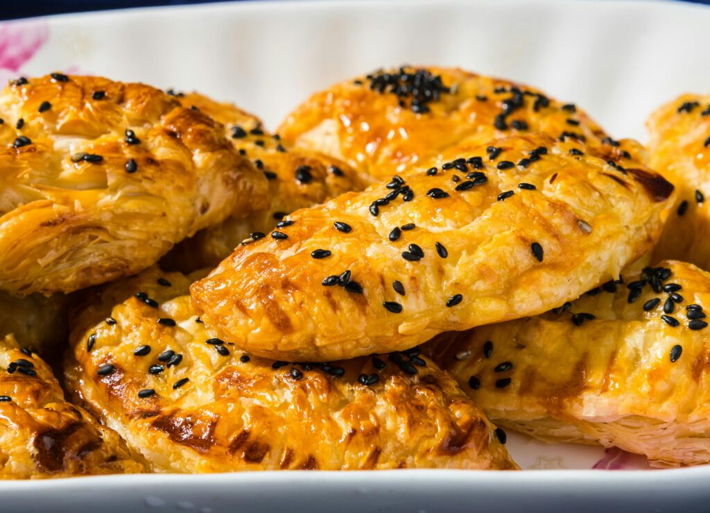 Baked Chicken Pastries made as mini round chicken pot pies served as Eid party snacks