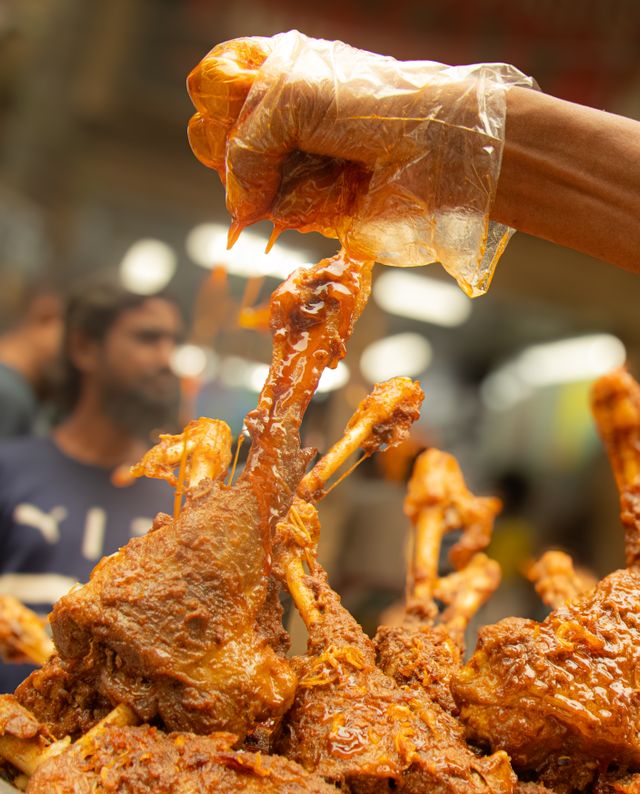 Oven baked mutton raan roast pieces served on skewers with spices