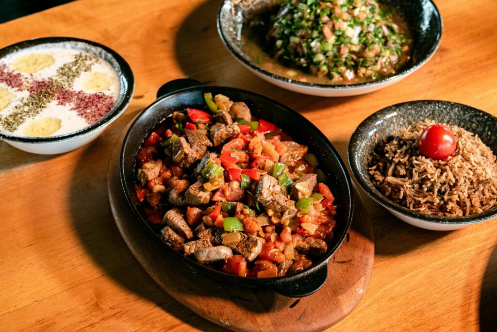 Homemade traditional pakistani style mutton kaleji fry on a wooden dining table