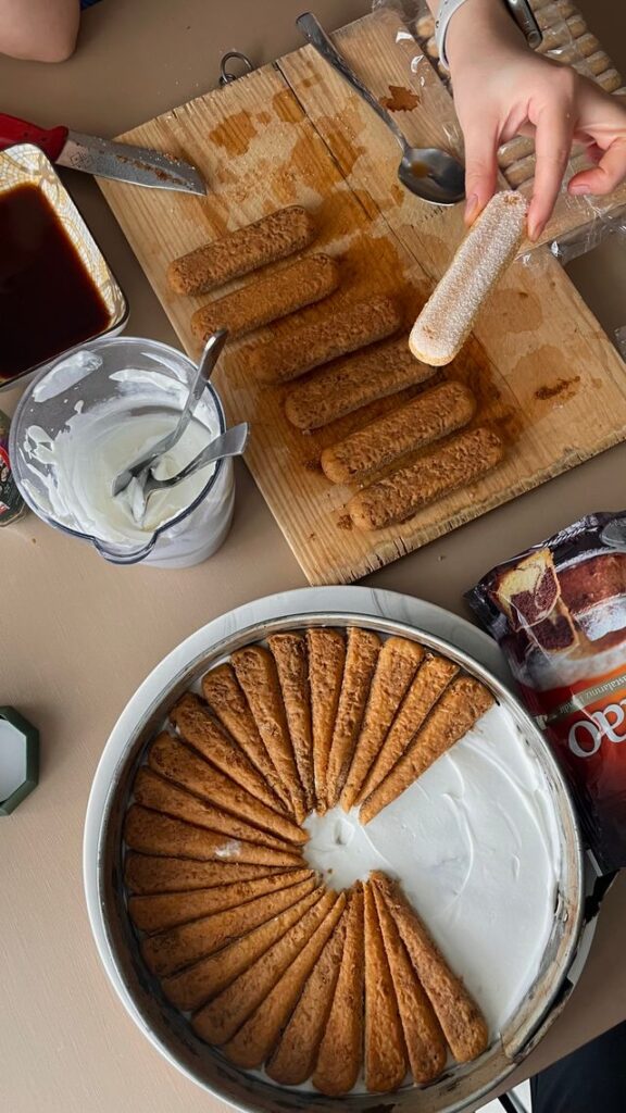 Eggless biscuit bars recipe ingredients prepared on wooden board with milk