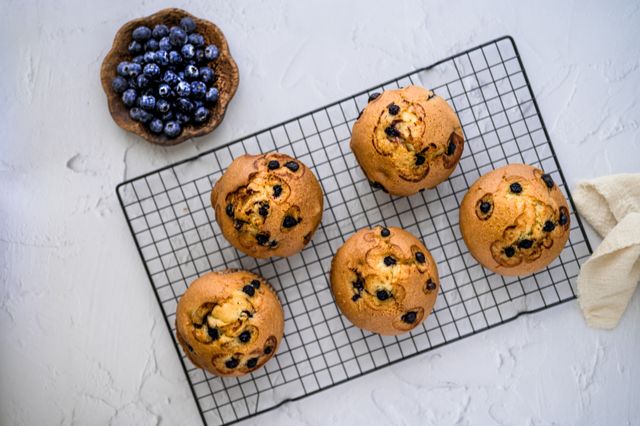 Lunchbox friendly muffin recipe with chocolate chip muffins cooling on a wire rack
