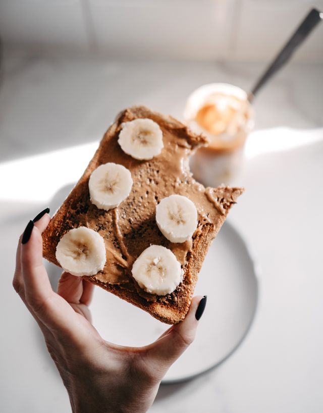 Eggless biscuit bars recipe topped with banana and chocolate spread