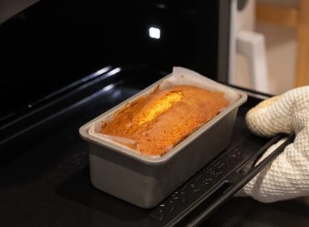 Loaf pan lined with parchment paper for baking